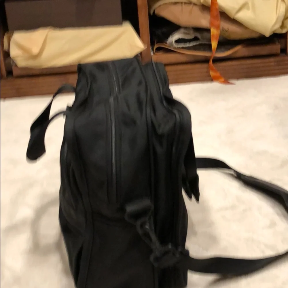 Tumi expandable crossbody suitcase/briefcase